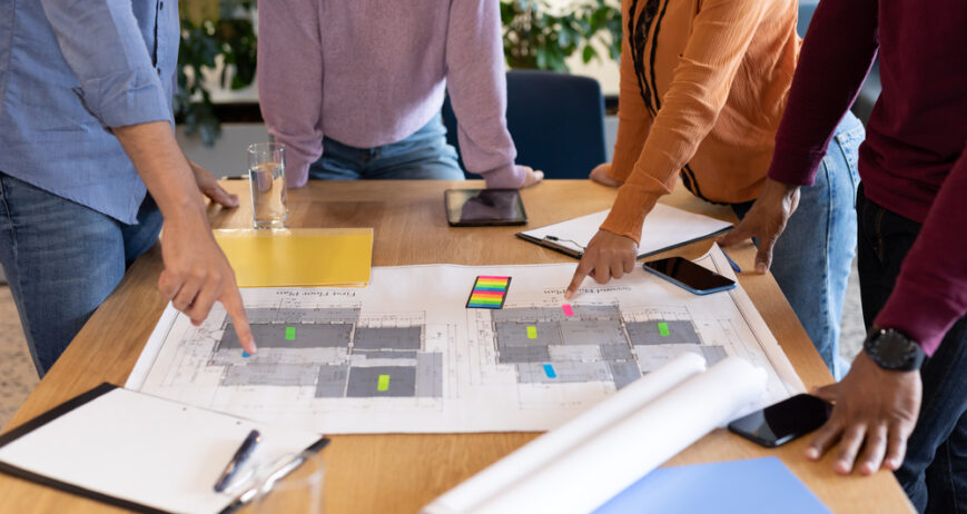 Diverse group of business people working in creative office. group of people in a meeting discussing work. business people and work colleagues at a busy creative office.